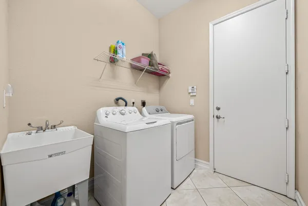 a utility room with dryer and washer