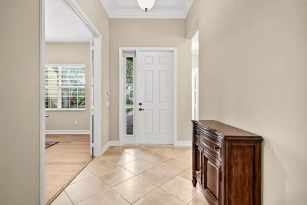 a view of a hallway with closet and bathroom