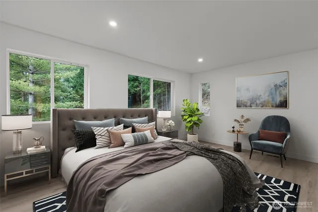 a bedroom with a bed and a chair