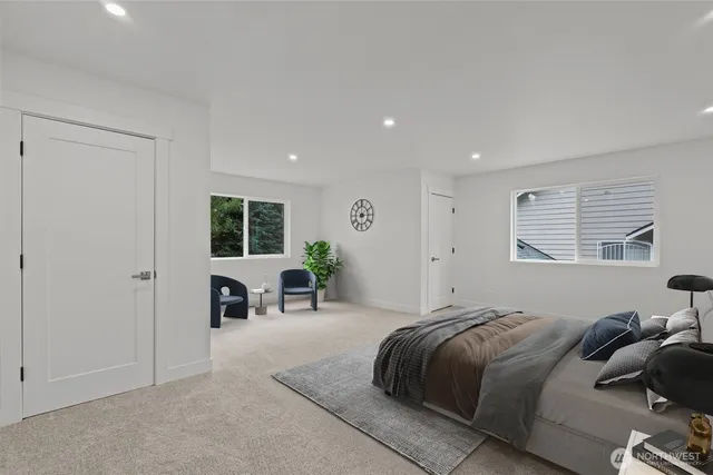 a bedroom with a bed a table and chair