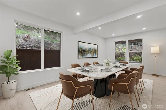 a view of a dining room with furniture window and outside view