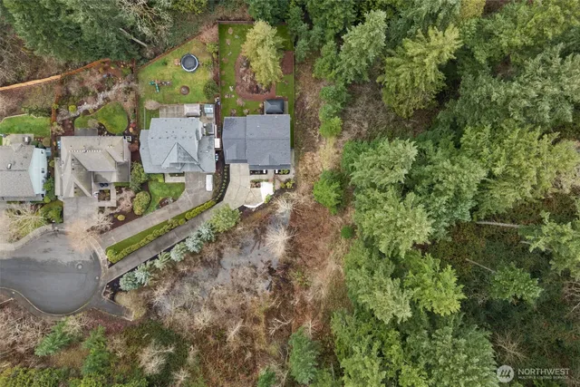 an aerial view of a house with a yard