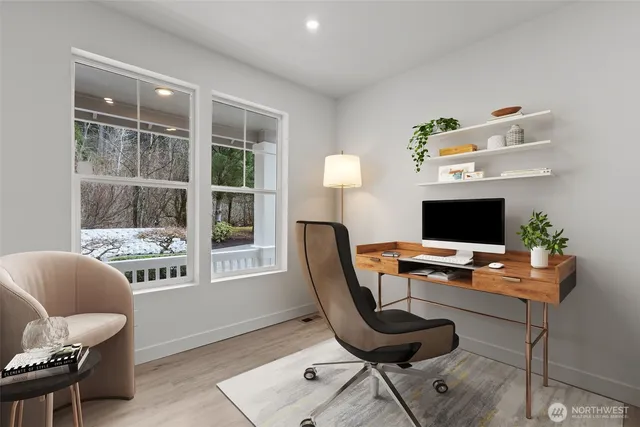 a work room with furniture and a window
