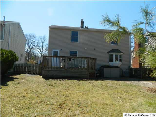 1138 Oak Road Manasquan, NJ 08736 - Photo 6 of 6 a front view of a house with a yard