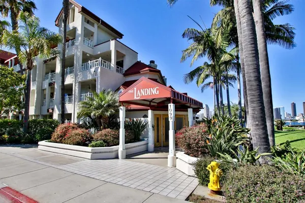 a house with palm tree in front of it