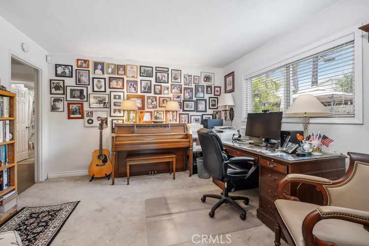 9331 Cape Cod Drive Huntington Beach, CA 92646 - Photo 14 of 31 a view of a workspace with a window and lounge chair