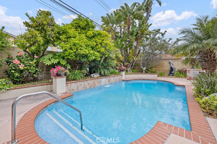 9331 Cape Cod Drive Huntington Beach, CA 92646 - Photo 26 of 31 a view of a swimming pool with an outdoor seating