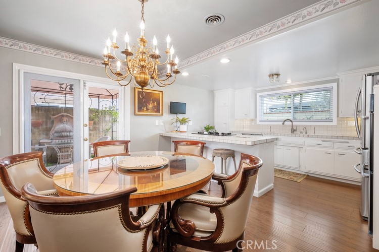9331 Cape Cod Drive Huntington Beach, CA 92646 - Photo 4 of 31 a dining room with furniture and window
