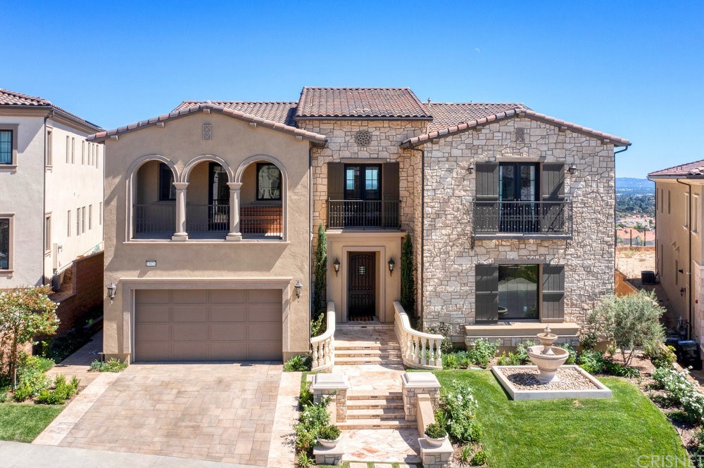 11624 North Manchester Way Porter Ranch, CA 91326 - Photo 1 of 1 a front view of a house with garden