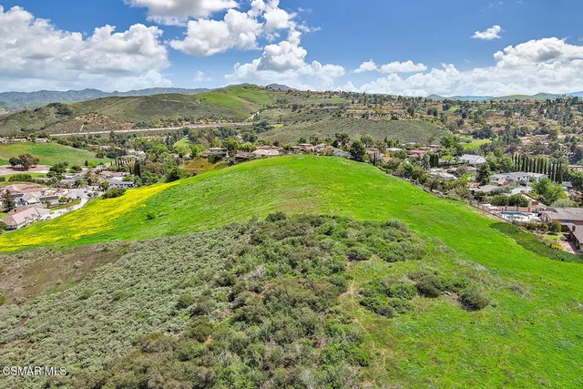 a view of a city with mountains in the background