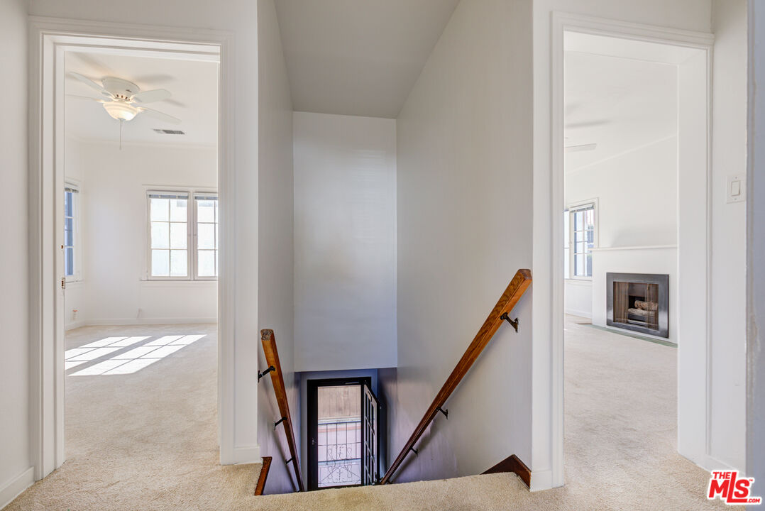 1447 North Vista Street, Unit 1/2 Los Angeles, CA 90046 - Photo 22 of 23 a view of a hallway with wooden floor and staircase
