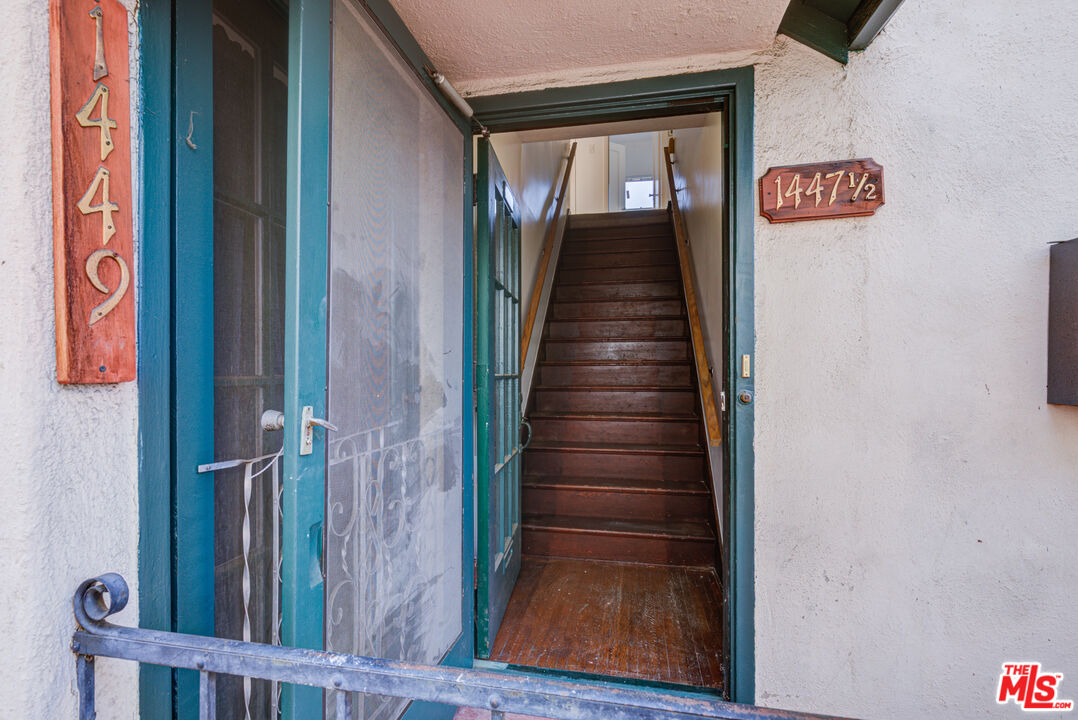 1447 North Vista Street, Unit 1/2 Los Angeles, CA 90046 - Photo 5 of 23 a view of a hallway with wooden floor and staircase