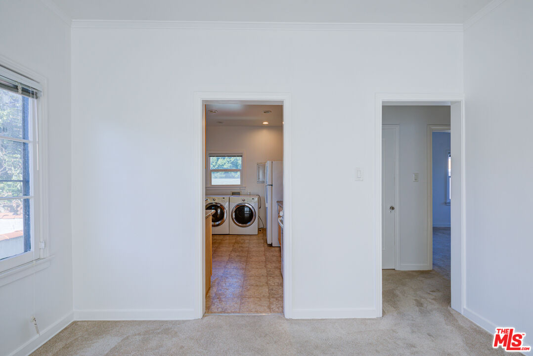 1447 North Vista Street, Unit 1/2 Los Angeles, CA 90046 - Photo 9 of 23 a view of a room that has a door and a closet