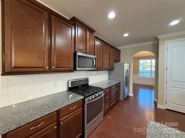 a bathroom with a sink a light fixture and a view