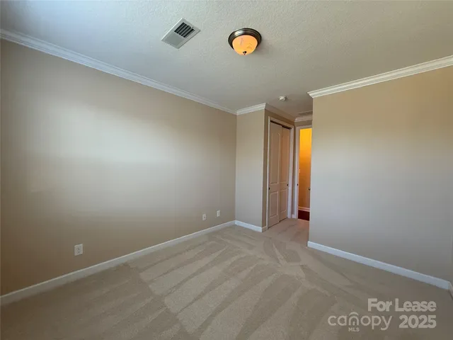 an empty room with a empty space and windows