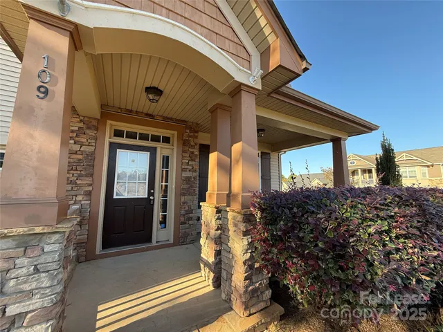 a view of entryway with wooden floor and stairs