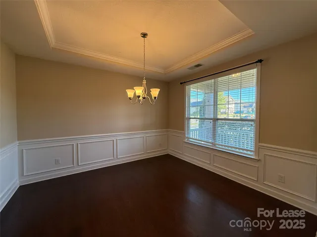 a view of a kitchen with a dishwasher cabinets and a wooden floor