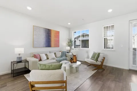a living room with furniture and a lamp