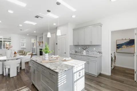 a kitchen with a stove and a refrigerator
