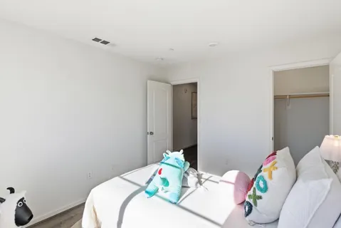 a bedroom with a bed and a table