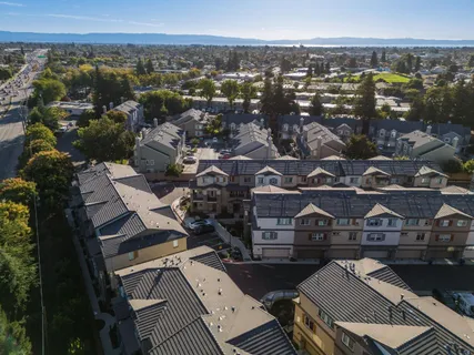 an aerial view of a house with a ocean view