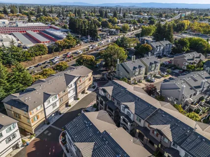 an aerial view of a residential houses with outdoor space