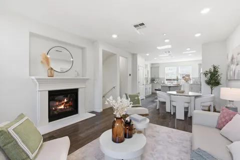 a living room with furniture a fireplace and a fireplace