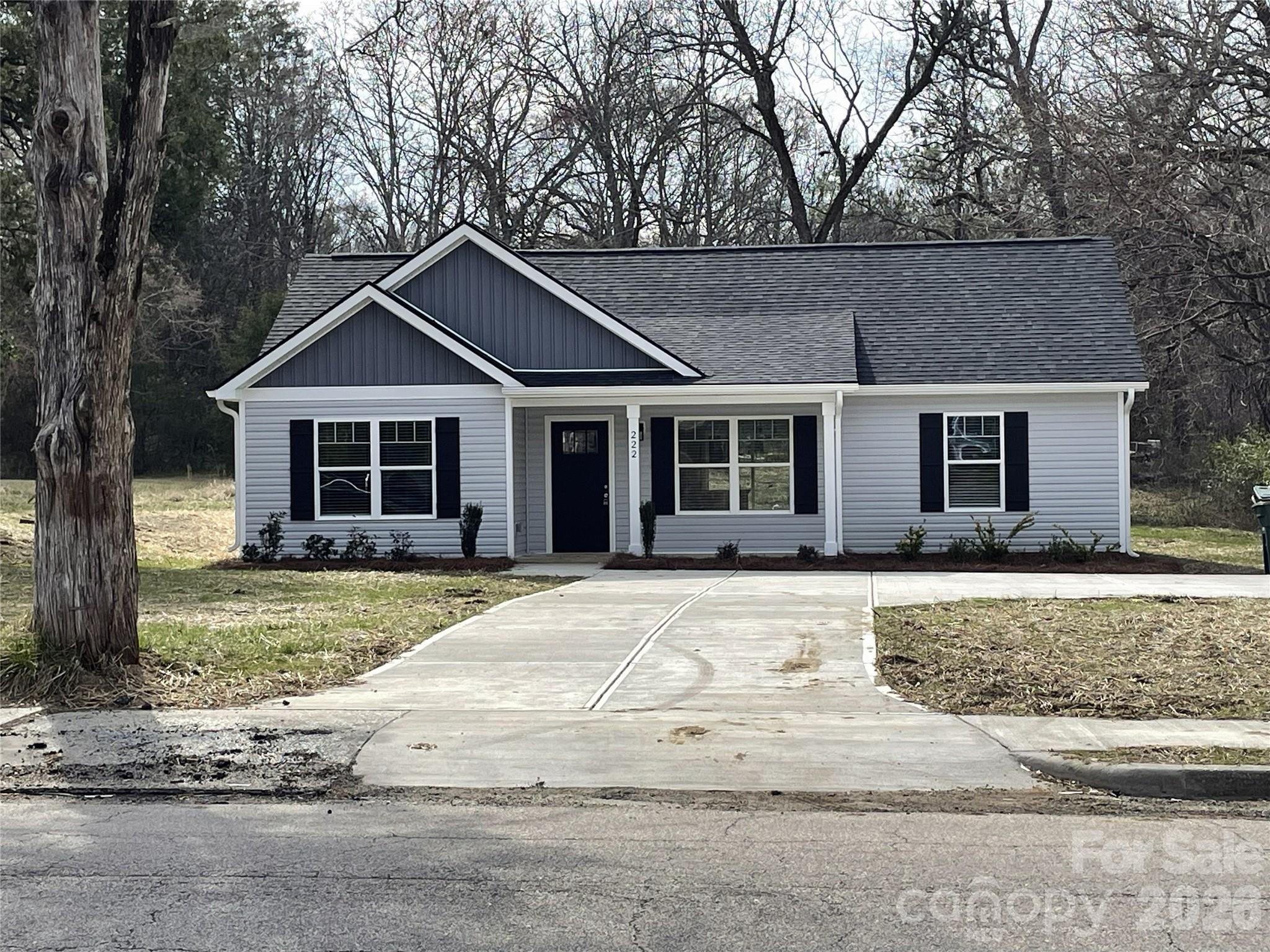 222 Center Street Chester, SC 29706 - Photo 2 of 23 a front view of a house with a garden