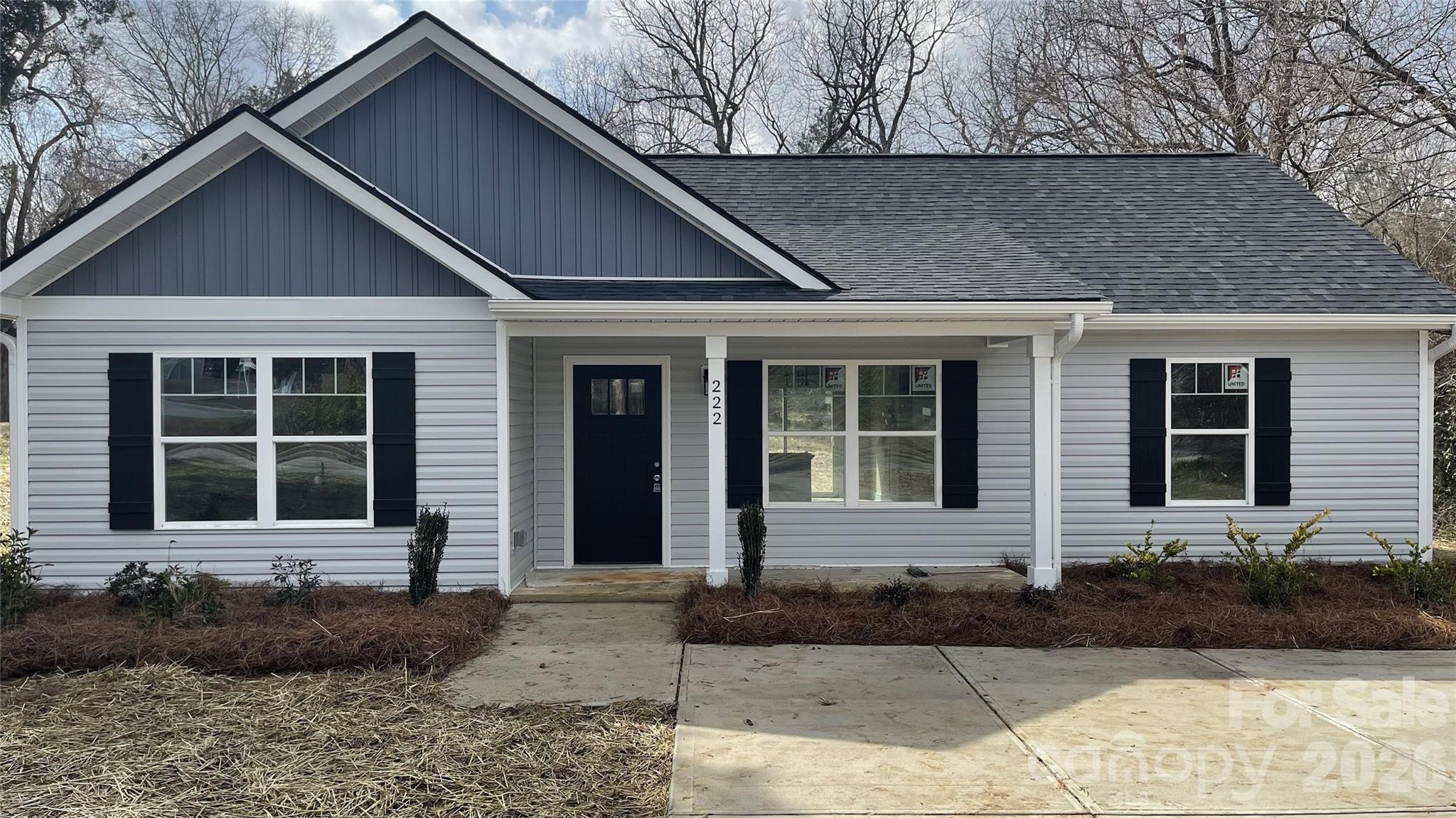 222 Center Street Chester, SC 29706 - Photo 3 of 23 a front view of a house with a yard