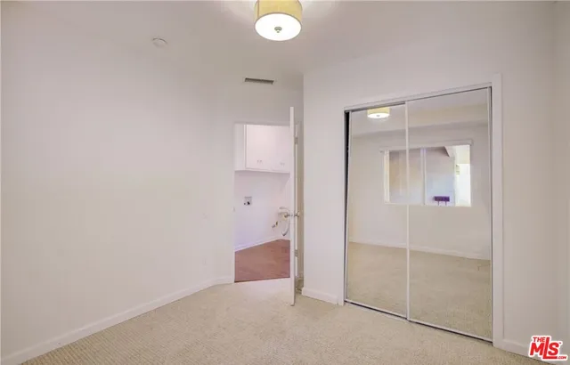 an empty room with mirror