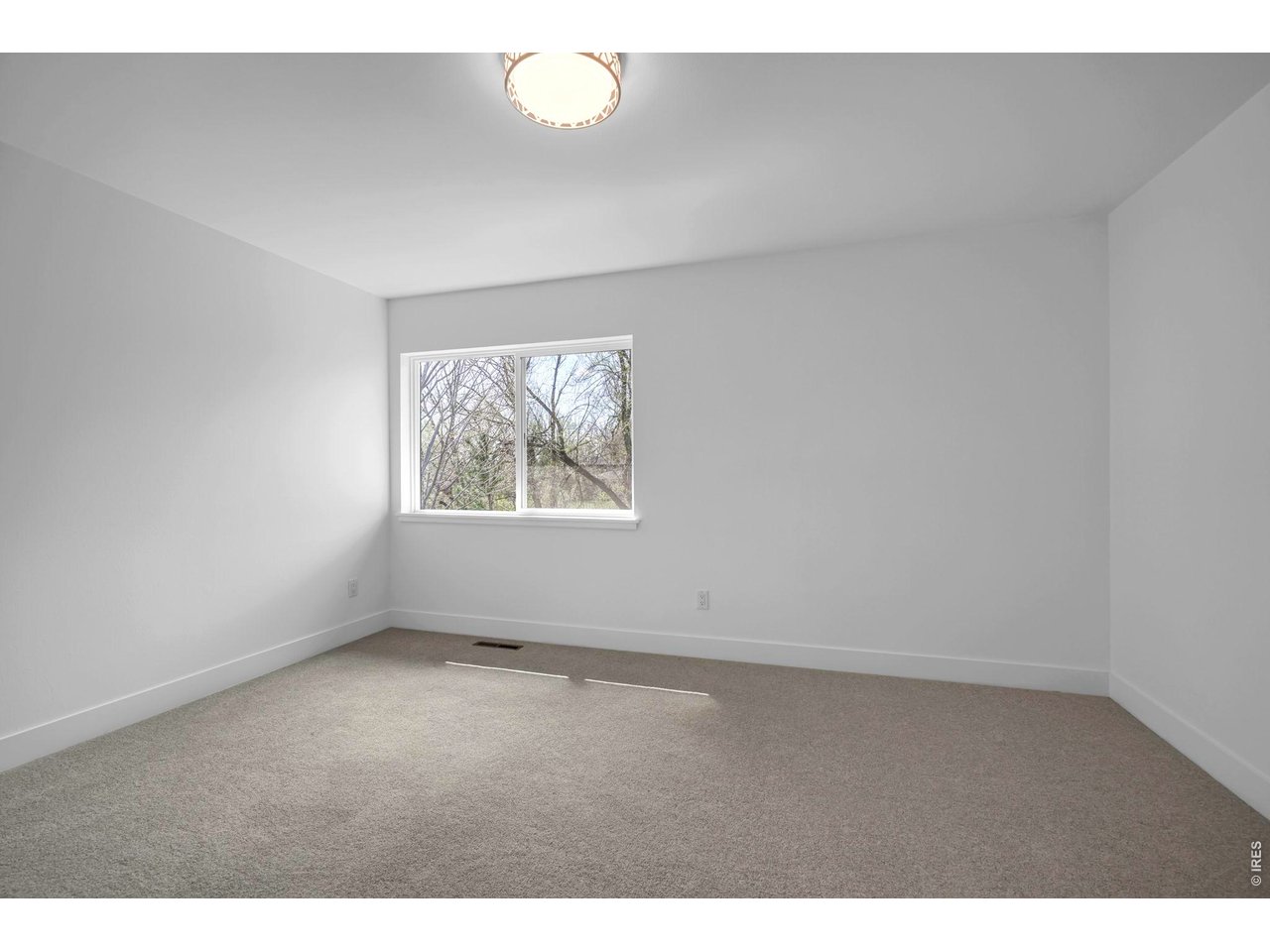 4240 Corriente Place Boulder, CO 80301 - Photo 11 of 21 an empty room with a window