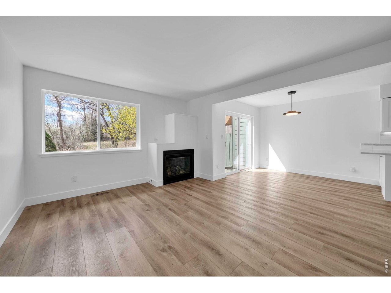 4240 Corriente Place Boulder, CO 80301 - Photo 4 of 21 a view of an empty room with window and wooden floor