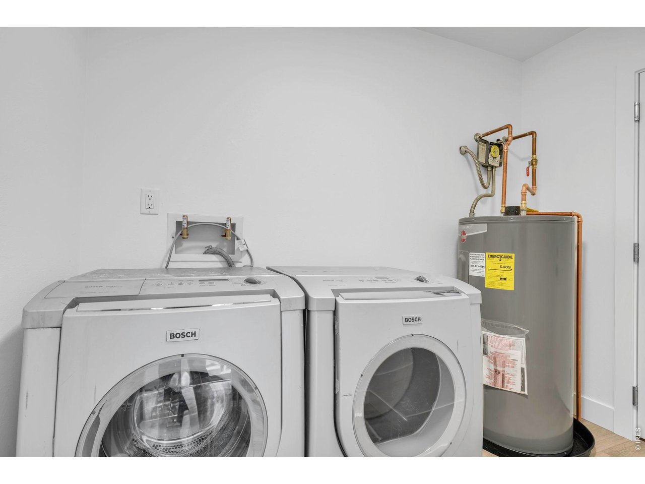 4240 Corriente Place Boulder, CO 80301 - Photo 9 of 21 a utility room with dryer and washer