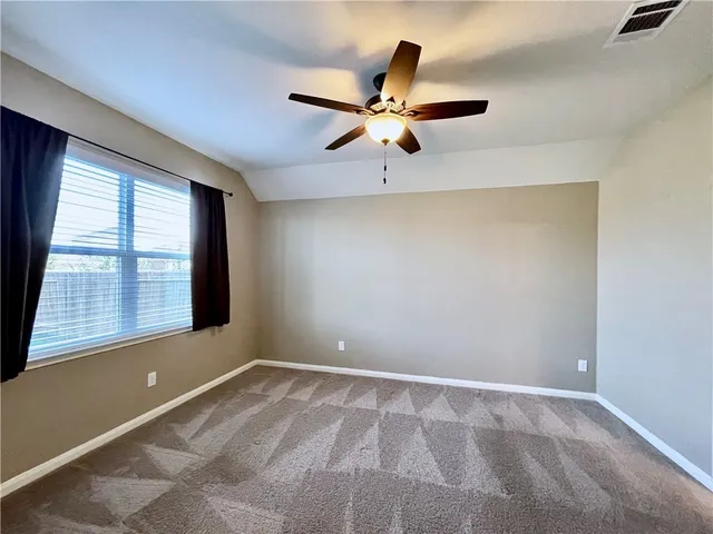 a bathroom with a double vanity sink a toilet and a large mirror