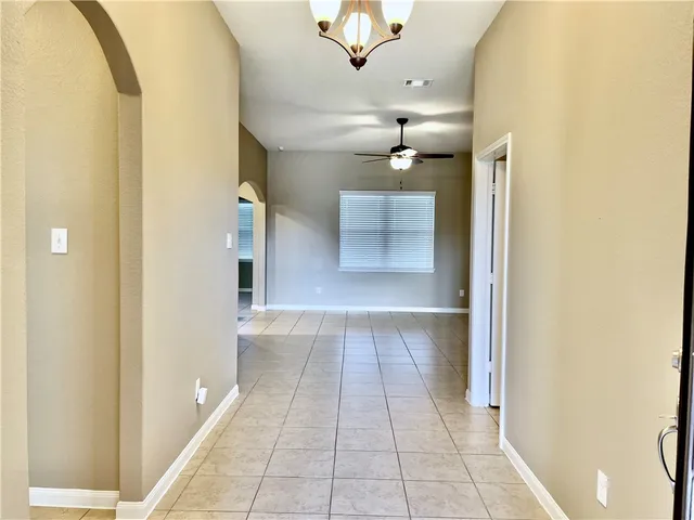 a view of a kitchen with microwave and furniture