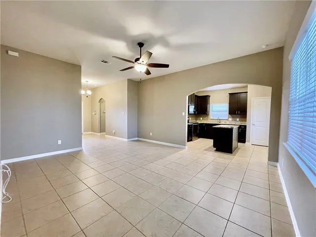a bathroom with a granite countertop sink a toilet and mirror