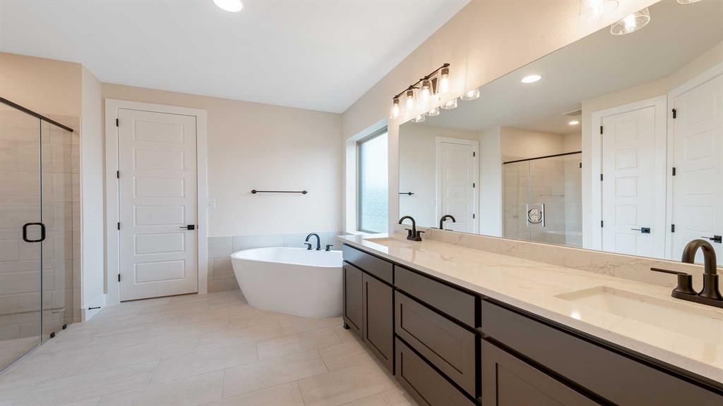 854 Stoney Bridge Way Lavon, TX 75166 - Photo 15 of 36 a spacious bathroom with a sink and a mirror