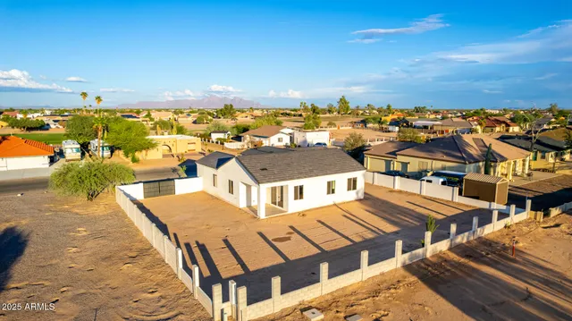 a view of residential houses with outdoor space