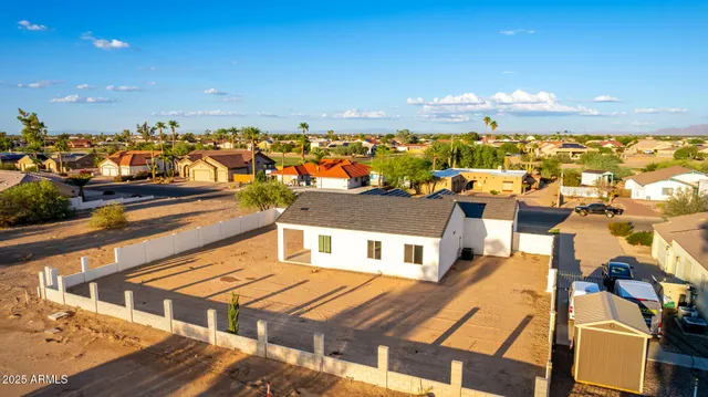 an aerial view of a house with a lake view