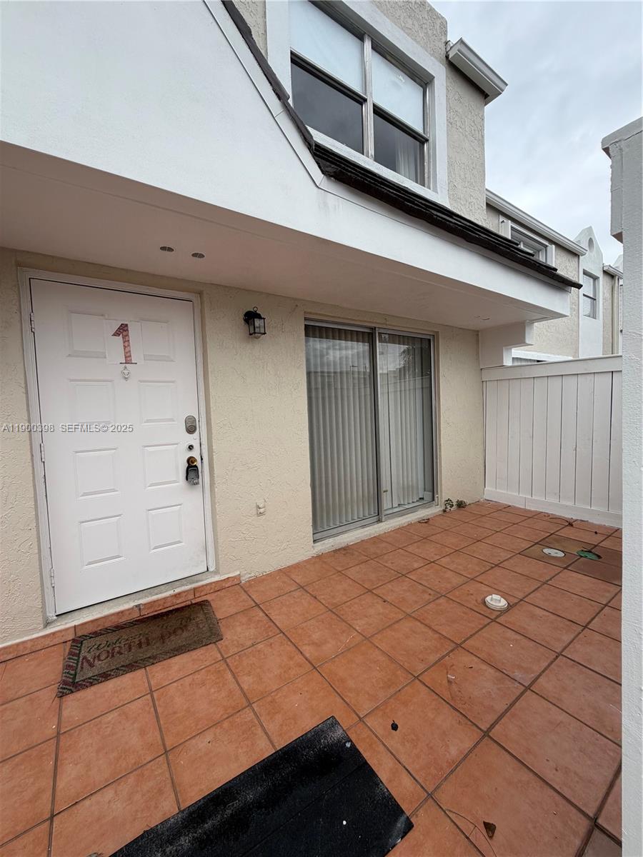 4515 Southwest 68th Ct Circle, Unit 1 Miami, FL 33155 - Photo 4 of 16 a bedroom with a bed and a window