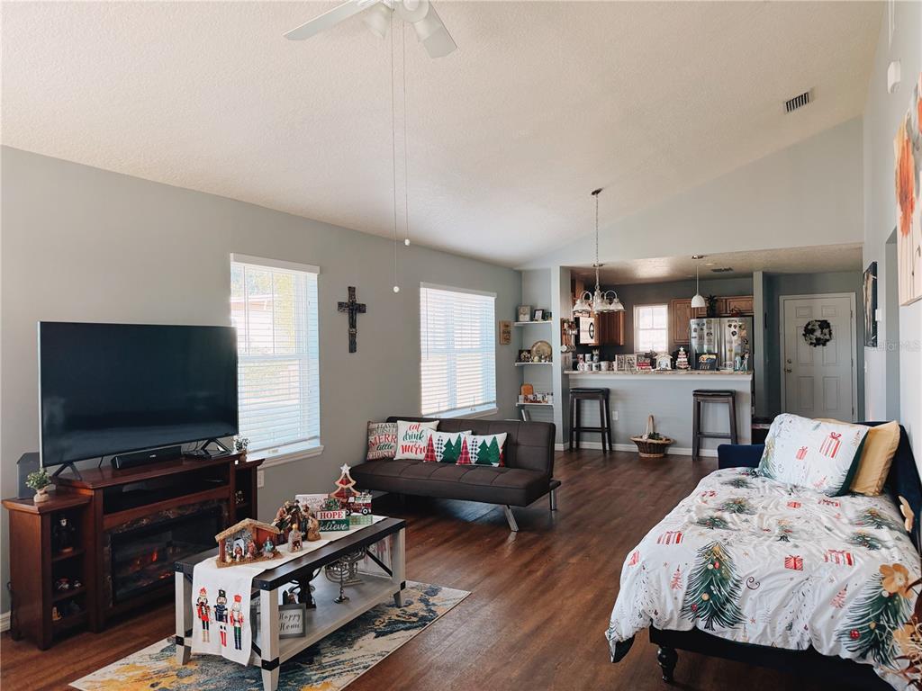 110 Turtle Run Umatilla, FL 32784 - Photo 4 of 15 a living room with furniture and a flat screen tv