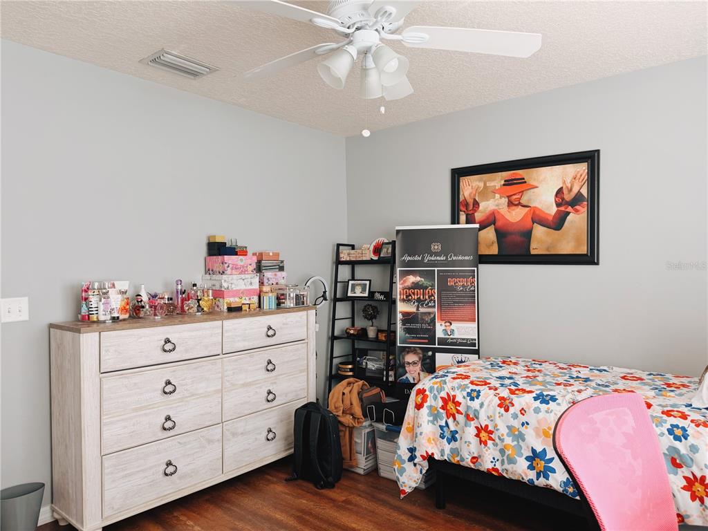 110 Turtle Run Umatilla, FL 32784 - Photo 8 of 15 a bedroom with a bed and dresser