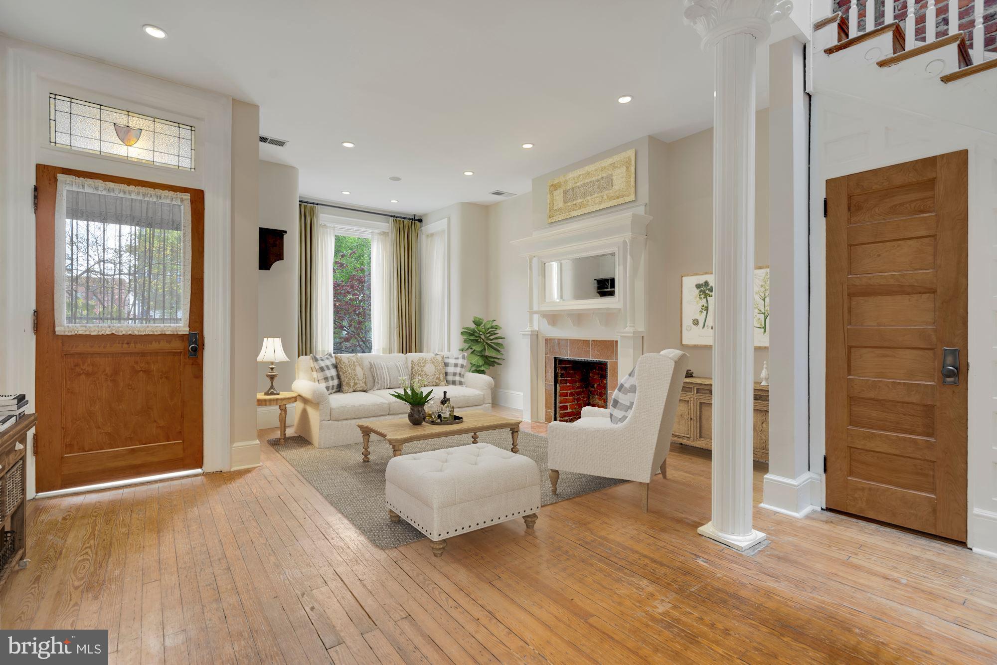 2721 2721-upper Ontario Road Northwest Washington, DC 20009 - Photo 2 of 31 a living room with furniture and a fireplace