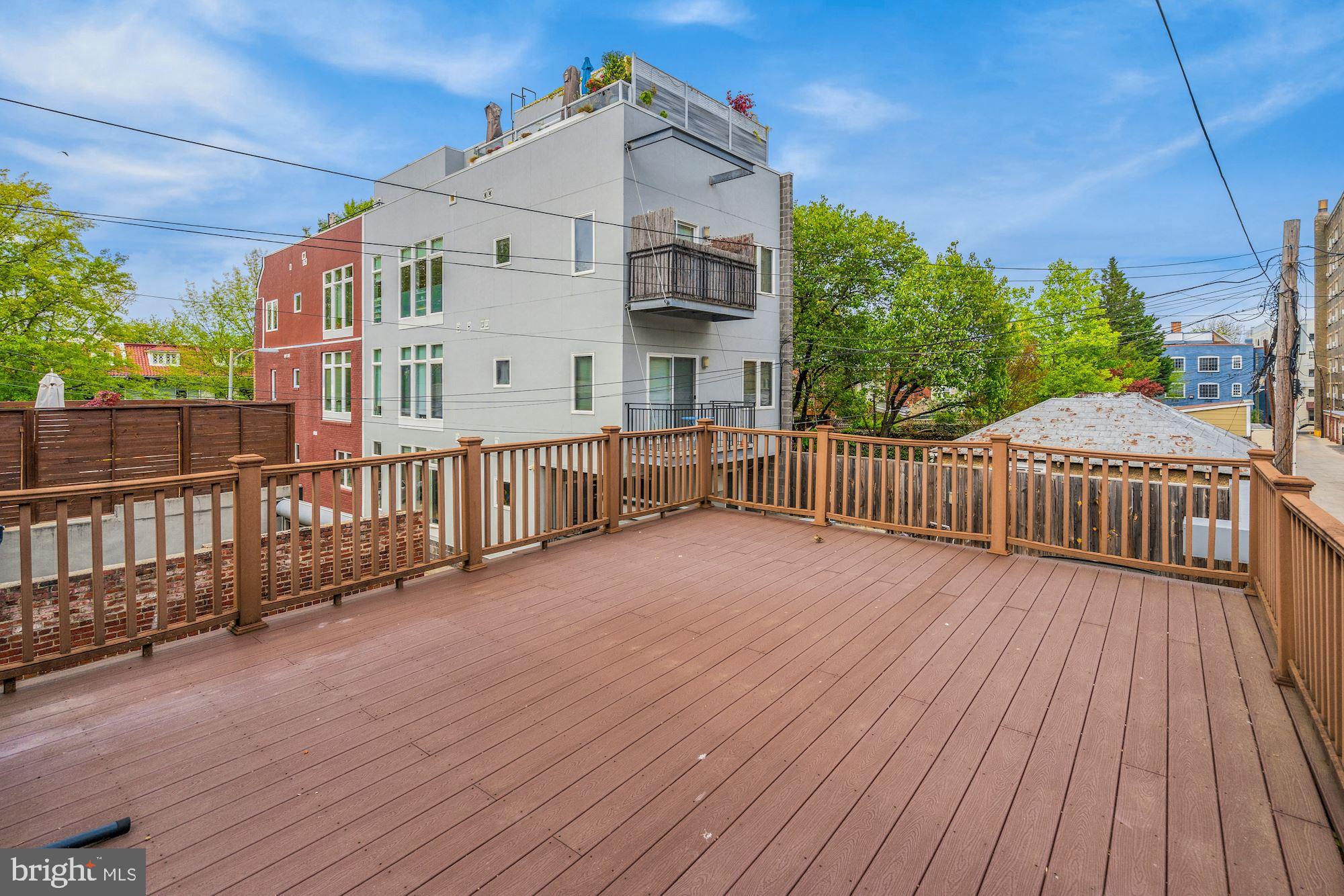 2721 2721-upper Ontario Road Northwest Washington, DC 20009 - Photo 13 of 31 a view of a house with wooden deck