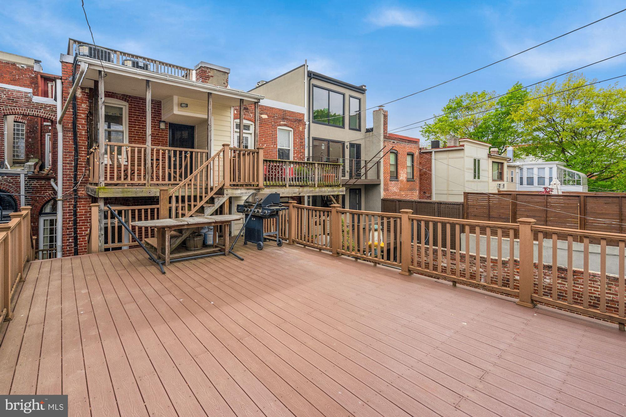 2721 2721-upper Ontario Road Northwest Washington, DC 20009 - Photo 14 of 31 a view of a house with deck and wooden floor