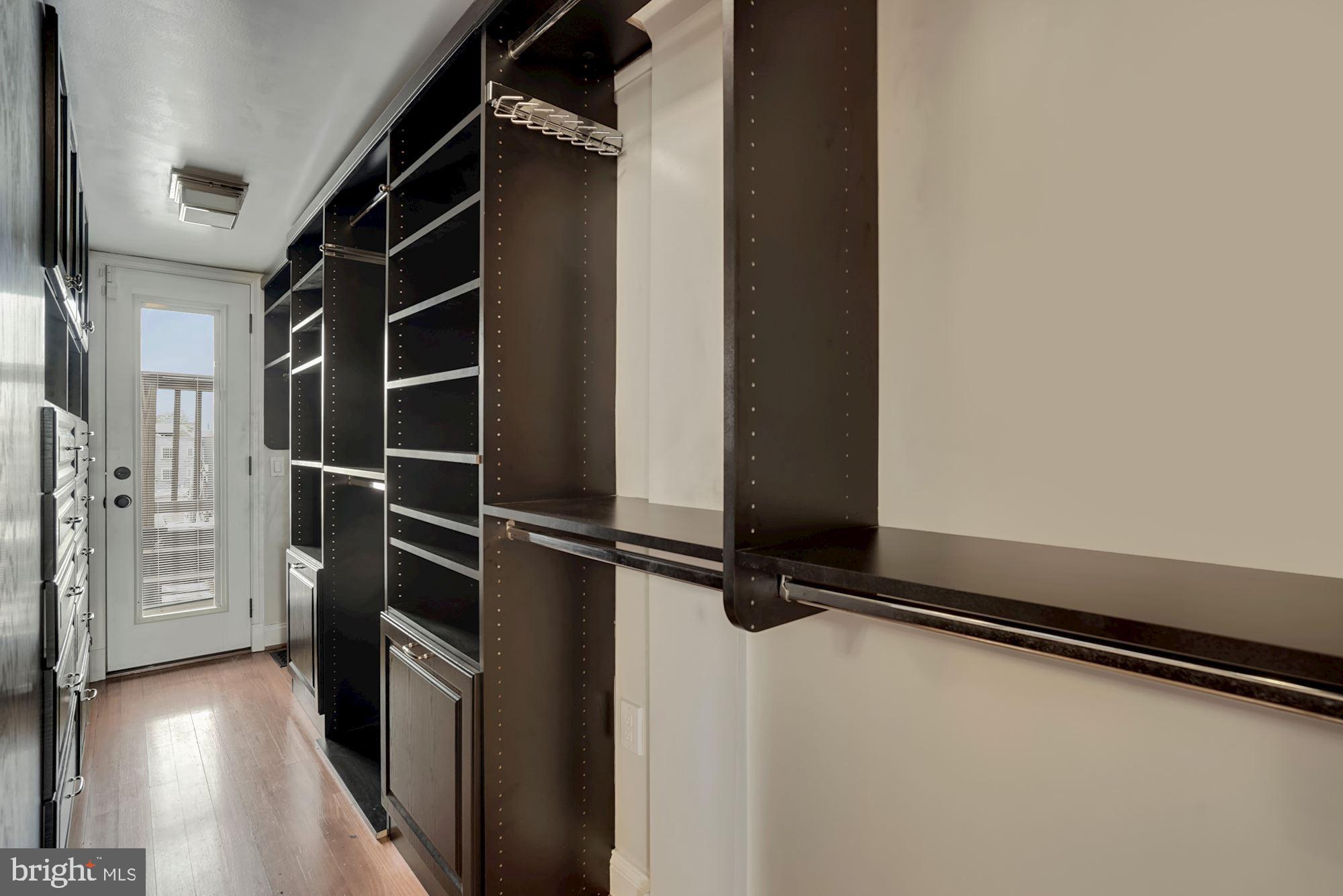 2721 2721-upper Ontario Road Northwest Washington, DC 20009 - Photo 20 of 31 a view of walk in closet with empty racks