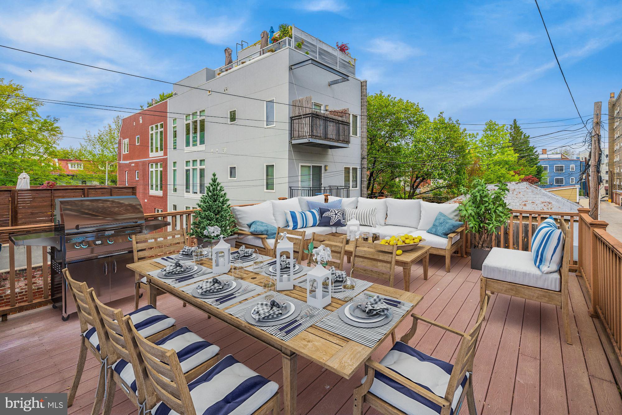 2721 2721-upper Ontario Road Northwest Washington, DC 20009 - Photo 21 of 31 a view of a patio with couches table and chairs and potted plants