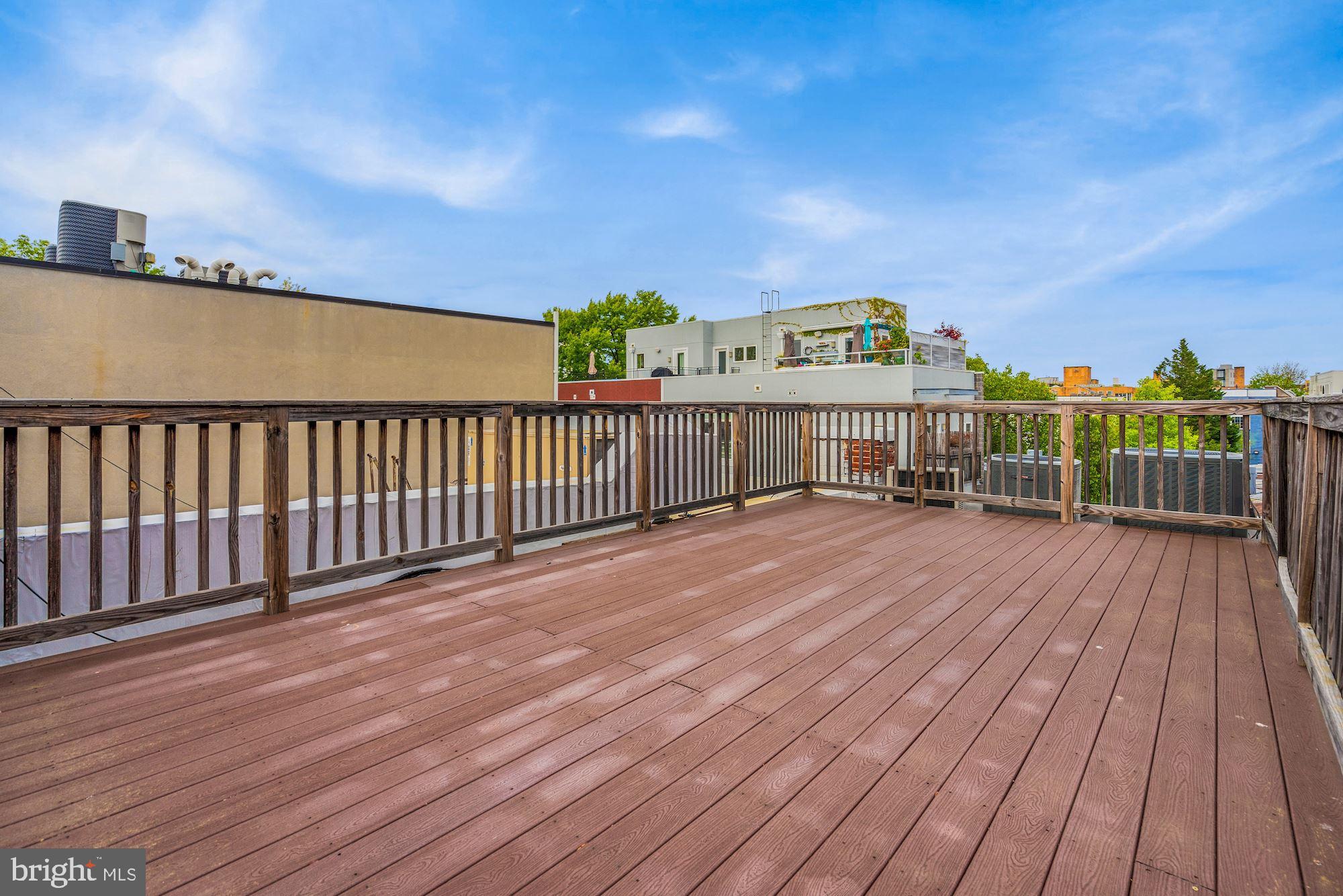 2721 2721-upper Ontario Road Northwest Washington, DC 20009 - Photo 22 of 31 a view of a balcony with wooden floor