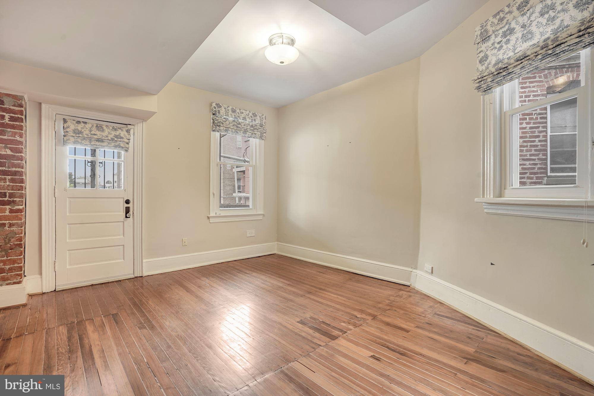 2721 2721-upper Ontario Road Northwest Washington, DC 20009 - Photo 25 of 31 a view of empty room with wooden floor and fan
