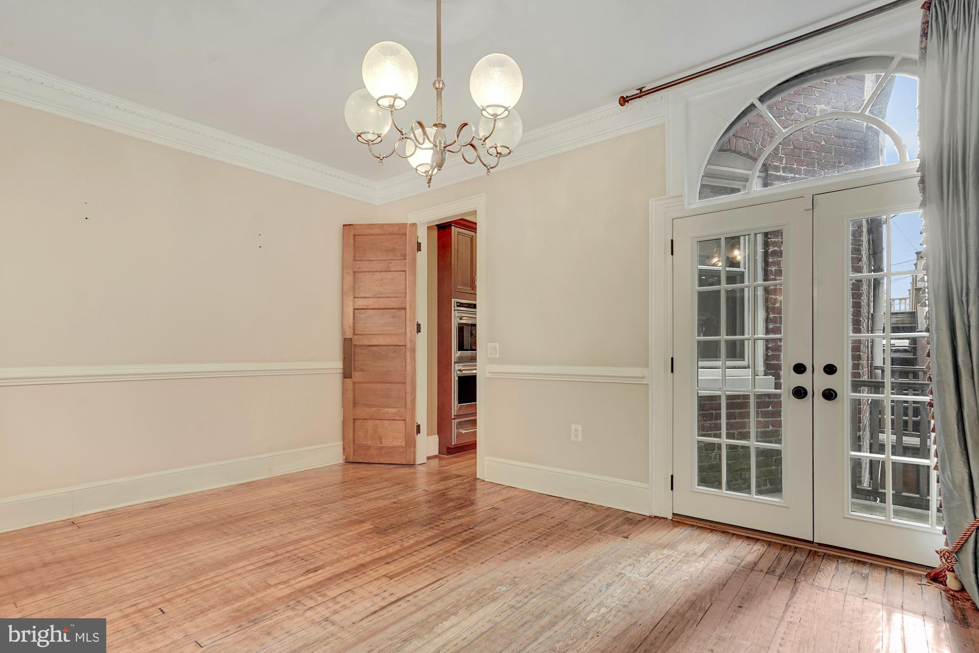 2721 2721-upper Ontario Road Northwest Washington, DC 20009 - Photo 9 of 31 wooden floor in an empty room with a window